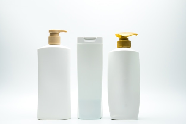 Set of shampoo and hair conditioner plastic bottle with golden pump