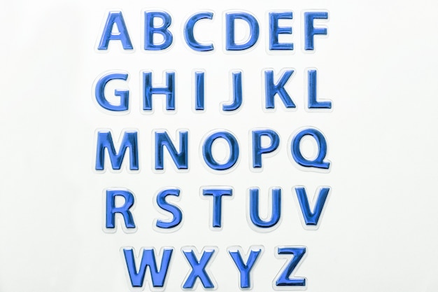 Set of shiny blue glossy letters, isolated on white background. Symbol of english alphabet abc.