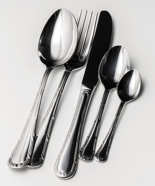 Set of silver cutlery on a white background