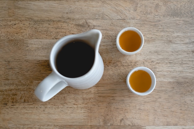 Set of simple white Chinese tea on a wooden table.