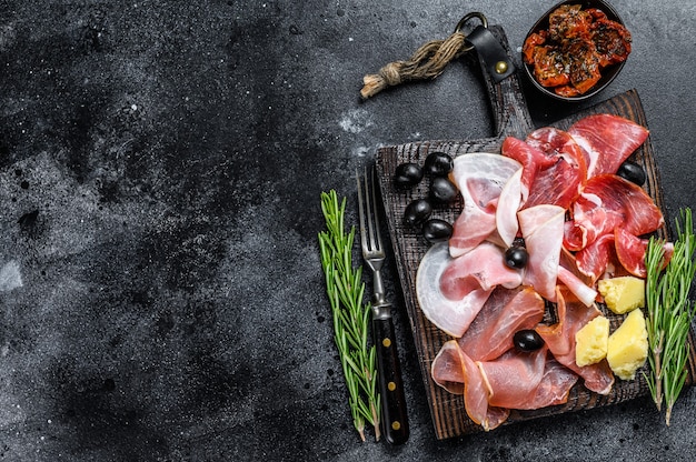 Photo set of smoked and dried meat ham, jerky, salted meat, jamon and herbs.