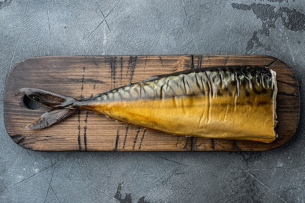 Set of smoked fish mackerel, on gray background, top view flat lay