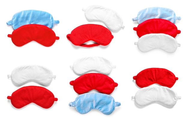 Set of soft sleep masks on white background top view