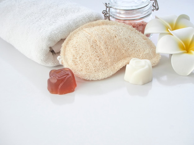 Set of spa accessories on a white table