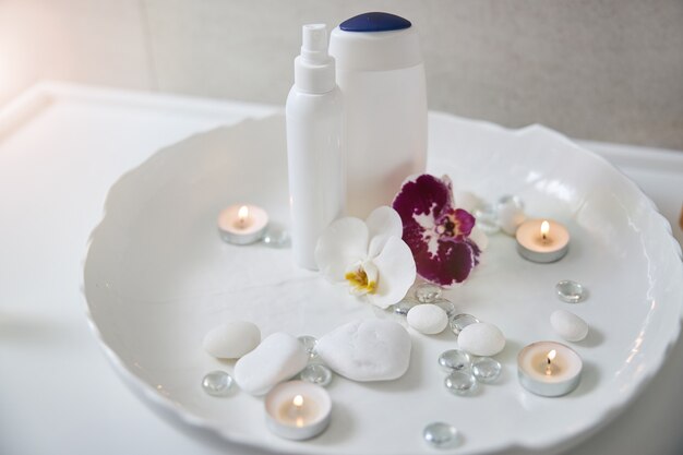 Set for spa procedure with orchids, shower gel and lotion