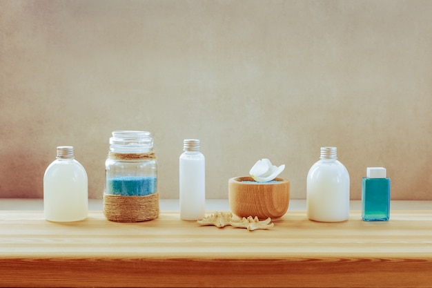 A set of Spa products on a wooden shelf 