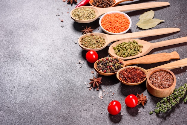 A set of spices and herbs. Indian cuisine. Pepper, salt, paprika, basil and other. Top view.