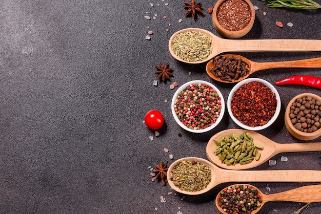 A set of spices and herbs. Indian cuisine. Pepper, salt, paprika, basil and other. Top view.