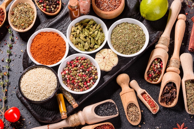 a set of spices and herbs. indian cuisine. pepper, salt, paprika, basil. top view.