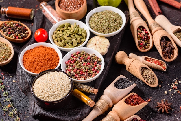 A set of spices and herbs. Indian cuisine. Pepper, salt, paprika, basil. Top view.