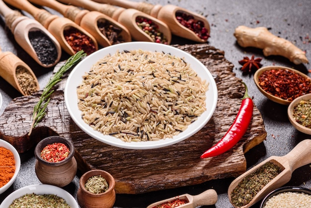 A set of spices and herbs. Indian cuisine. Pepper, salt, paprika, basil. Top view.