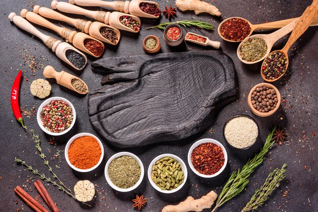 A set of spices and herbs. Indian cuisine. Pepper, salt, paprika, basil. Top view.