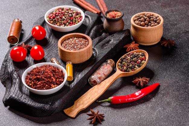 A set of spices and herbs. Indian cuisine. Pepper, salt, paprika, basil. Top view.