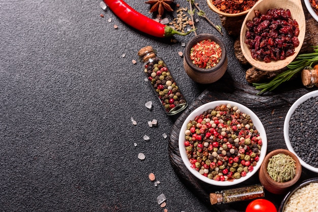 A set of spices and herbs. Indian cuisine. Pepper, salt, paprika, basil. Top view.