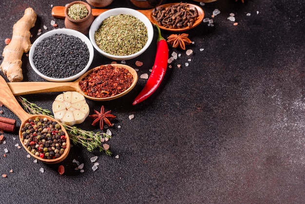 A set of spices and herbs. Indian cuisine. Pepper, salt, paprika, basil. Top view.