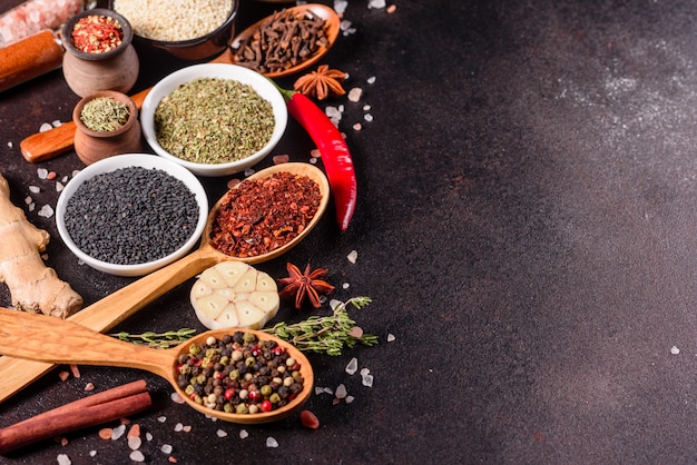 A set of spices and herbs. Indian cuisine. Pepper, salt, paprika, basil. Top view.