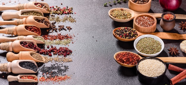 A set of spices and herbs. Indian cuisine. Pepper, salt, paprika, basil. Top view.