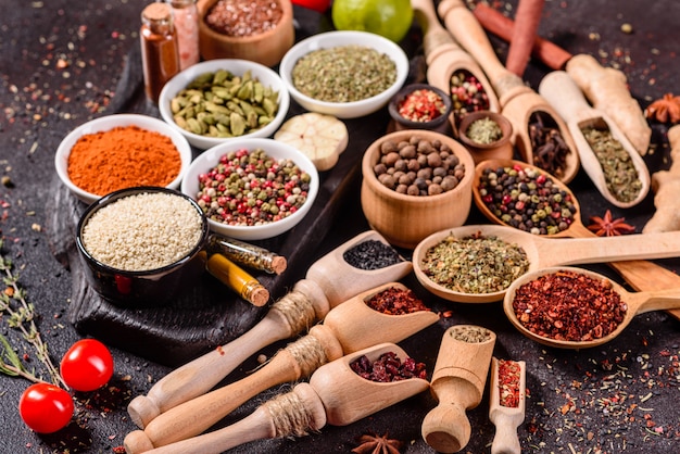 A set of spices and herbs. Indian cuisine. Pepper, salt, paprika, basil. Top view.