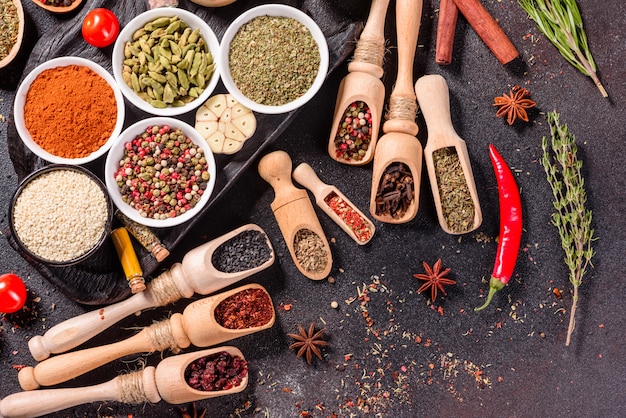 A set of spices and herbs. Indian cuisine. Pepper, salt, paprika, basil. Top view.