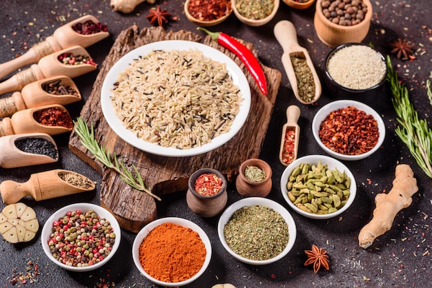 A set of spices and herbs. Indian cuisine. Pepper, salt, paprika, basil. Top view.