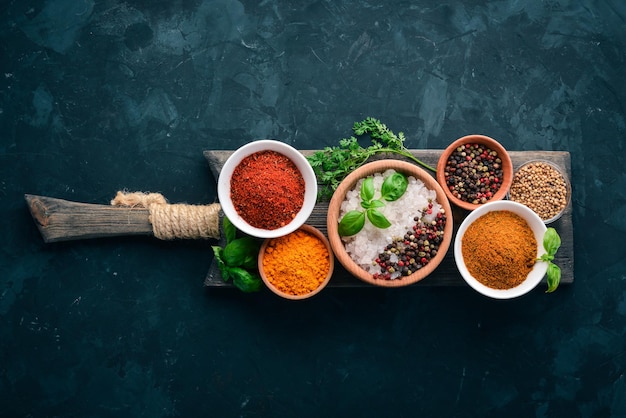 A set of spices and herbs on a stone table Indian traditional spices Top view Free copy space