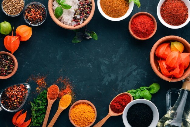 A set of spices and herbs on a stone table indian traditional spices top view free copy space