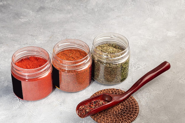 A set of spices on a light background in a glass bowl Enhancement of taste copy space