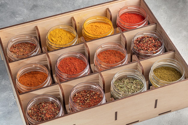 A set of spices on a light background in a glass bowl Enhancement of taste copy space