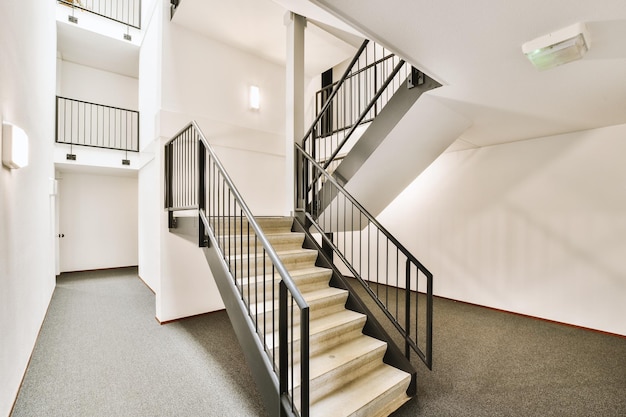 A set of stairs in a building with white walls