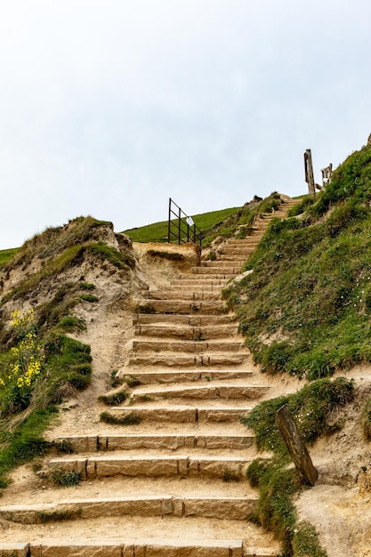 A set of steps leading up to a beach.