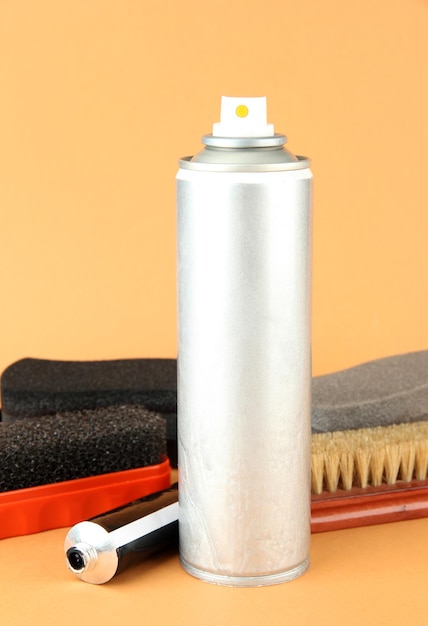 set of stuff for cleaning and polish shoes on color background