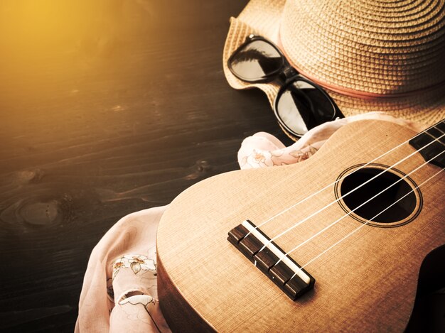 Set of summer vacation. Ukulele with sunglass and hat