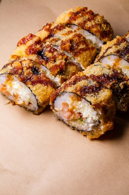 A set of sushi from many types of roles and with different stuffing. Sushi menu. Japanese gourmet sushi.