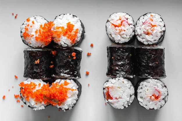 Set of sushi and maki on white background Flat lay top view