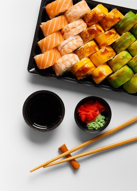 Set of sushi rolls in plastic packages on a white background