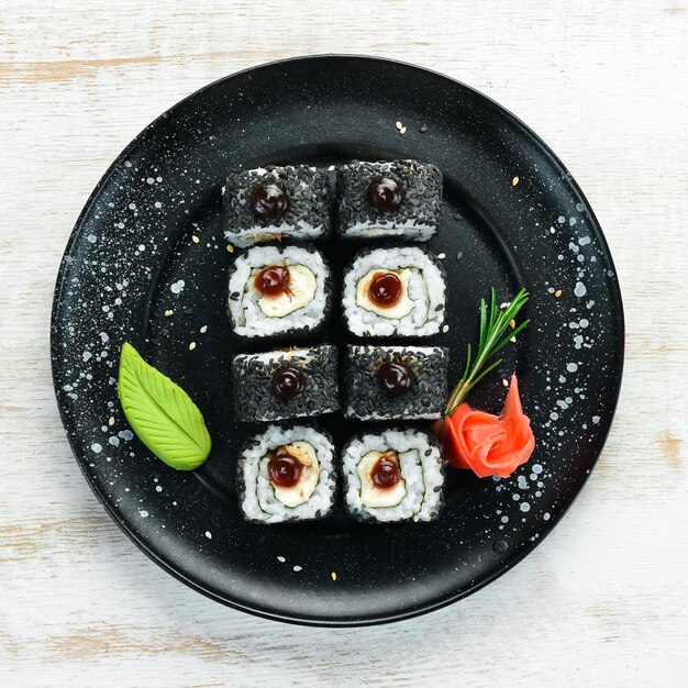 Set of sushi with eel fish and black sesame Sushi menus Top view Free space for your text