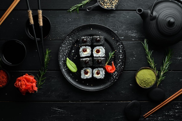 Set of sushi with eel fish and black sesame. Sushi menus. Top view. Free space for your text.