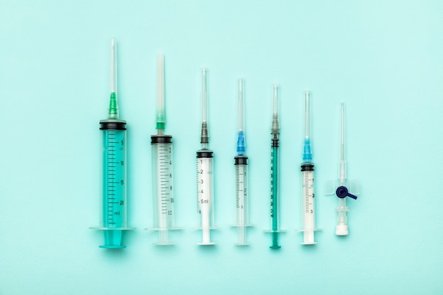 Set of syringe on colorful background