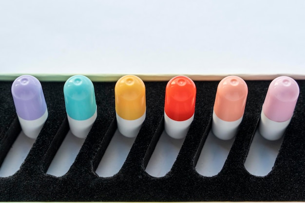 A set of tablets vitamins in capsules lying in a special box