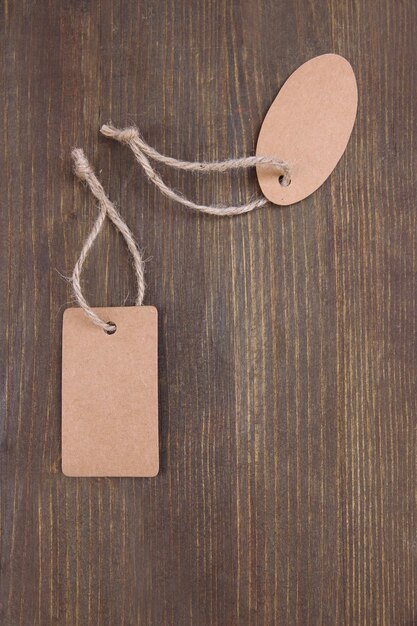 Set of tags on color wooden background