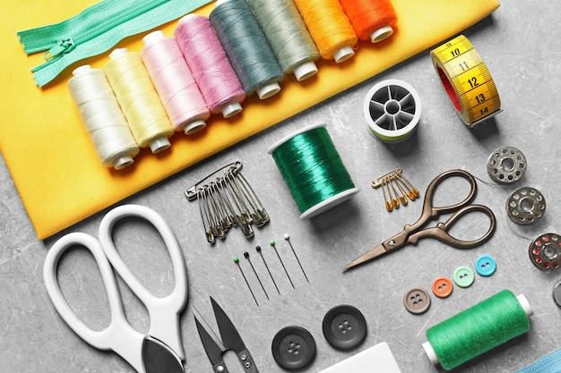 Set of tailoring tools and accessories on table top view