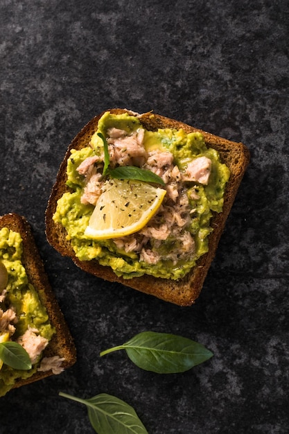 Set tasty tuna toast italian bruschetta sandwiches with canned\
tuna avocado olives delicious breakfast or snack top view