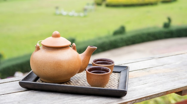 A set of a teapot on a balcony.