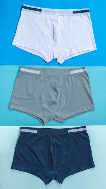 A set of three men's underpants on colorful backgrounds