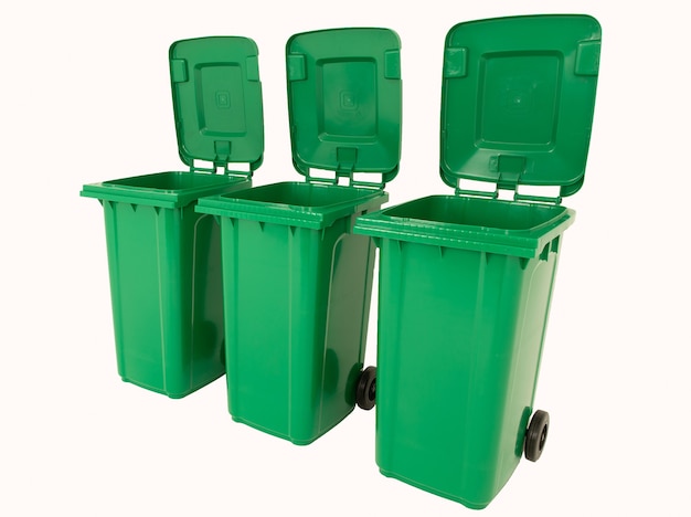 Set of three new unbox green large bins isolated on white background.