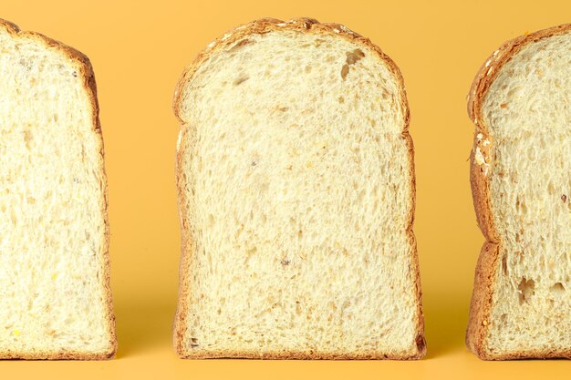 Set of three slices of bread slices isolated on yellow background