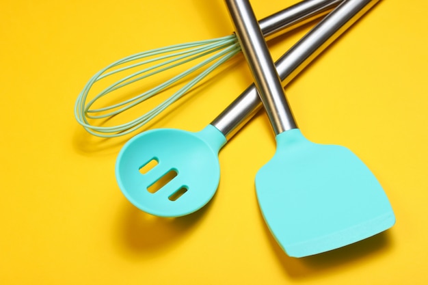 Set of tools for cooking. Silicone paddles with metal handles and whisk.