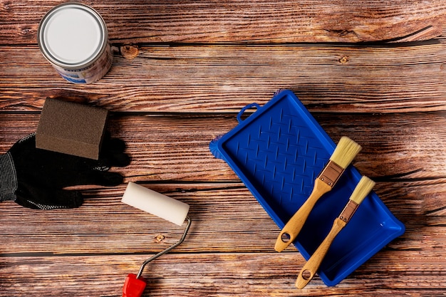 Set of tools for painting on wooden table top view