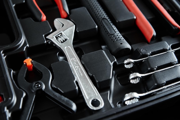 Set of tools for repair and maintenance on black background