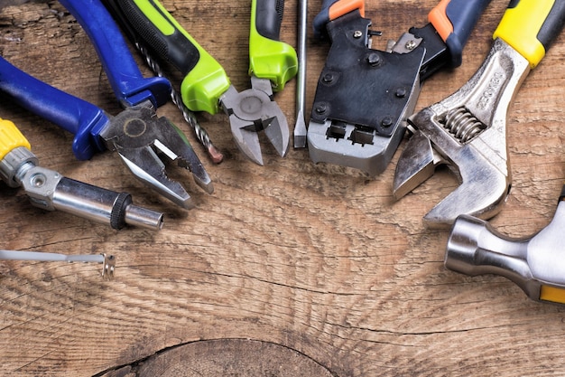 Set of tools over a wood background